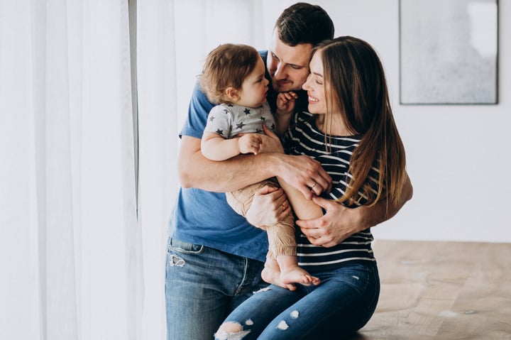 young-family-with-their-little-son-home